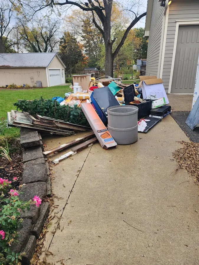 Dumpster being loaded with debris for 30 Yard Dumpster Rental in Williamsburg